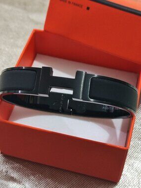 Hermès Engraved Logo Matte Black Bangle